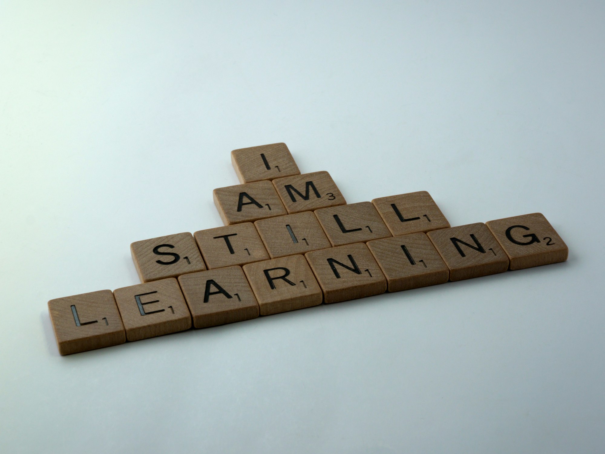 scrabble, scrabble pieces, lettering, letters, wood, scrabble tiles, words, quote, i am still learning